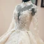 Luxe Vintage / Originale Champagne Transparentes Robe De Mariée 2019 Style Audrey Hepburn Robe Boule Col Haut Manches Longues Dos Nu Appliques En Dentelle Perlage Glitter Tulle Cathedral Train Volants