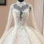 Luxe Vintage / Originale Champagne Transparentes Robe De Mariée 2019 Style Audrey Hepburn Robe Boule Col Haut Manches Longues Dos Nu Appliques En Dentelle Perlage Glitter Tulle Cathedral Train Volants