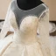 Luxury / Gorgeous Champagne See-through Wedding Dresses 2019 Ball Gown Scoop Neck Long Sleeve Backless Appliques Lace Beading Cathedral Train Ruffle