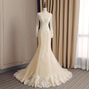 Élégant Champagne Transparentes Robe De Mariée 2019 Trompette Sirène Encolure Dégagée Manches Longues Dos Nu Appliques En Dentelle Faux Diamant Perlage Tribunal Train Volants