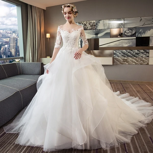 Chic / Beautiful Ivory Pierced Wedding Dresses 2018 Ball Gown Scoop Neck 1/2 Sleeves Backless Appliques Lace Cascading Ruffles Cathedral Train