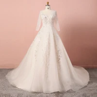 Luxe Champagne Grande Taille Robe De Mariée 2020 Princesse V-Cou Perlage Paillettes Fait main Tulle Manches Longues Cathedral Train Mariage