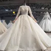 Luksusowe Czarujący Szampan Suknia Balowa Suknie Ślubne 2020 Długie Rękawy Wycięciem Skrzyżowane Pasy Koronki 3D Wykonany Ręcznie Aplikacje Bez Pleców Frezowanie Kryształ Kwiat Rhinestone Cekiny Trenem Katedra Ślub