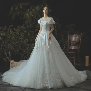 Moderne Mode Ivoire Robe De Mariée 2019 Princesse En Dentelle Appliques Perlage Perle Paillettes Encolure Dégagée Dos Nu Manches Courtes Royal Train