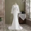 Mode Ivory / Creme Meerjungfrau Brautkleider / Hochzeitskleider 2021 Rundhalsausschnitt Pailletten Schleife Spitze Blumen Lange Ärmel Rückenfreies Sweep / Pinsel Zug Hochzeit