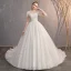 Élégant Ivoire Robe De Mariée 2019 Robe Boule Encolure Dégagée Perlage Cristal En Dentelle Fleur Manches Courtes Dos Nu Cathedral Train