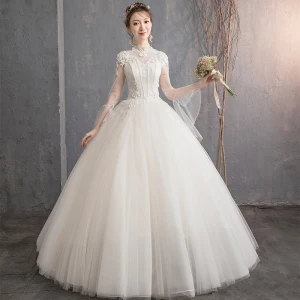 Élégant Champagne Robe De Mariée 2019 Princesse Col Haut Appliques En Dentelle Fleur Perlage Perle Paillettes Manches Longues Dos Nu Longue