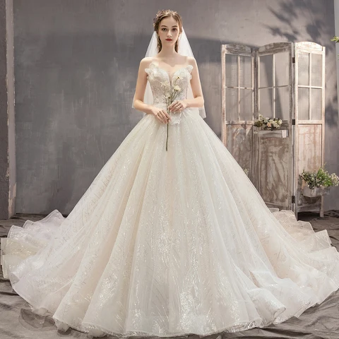 Fantastisk Champagne Bröllopsklänningar 2019 Prinsessa Axelbandslös Beading Paljetter Ärmlös Halterneck Appliqués Rosett Royal Train