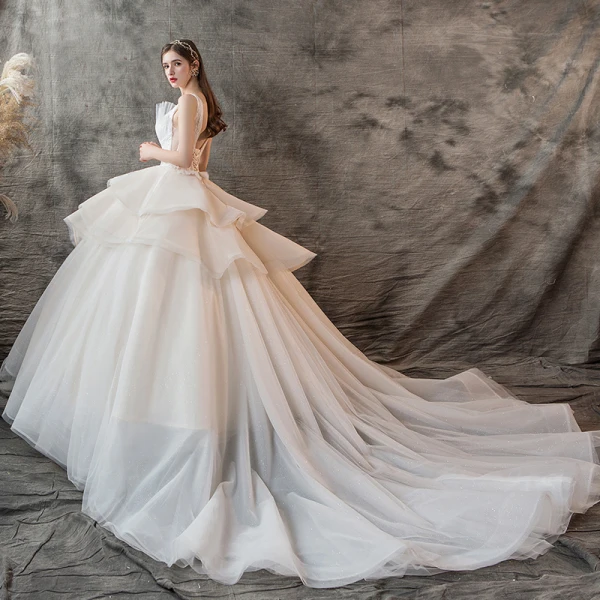 Charming Champagne Wedding Dresses 2019 Ball Gown V-Neck Pearl Sleeveless Backless Cascading Ruffles Cathedral Train