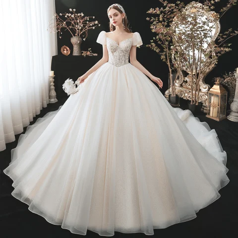Encantador Moda Champán Rebordear Lentejuelas Vestidos De Novia 2021 Ball Gown Scoop Escote Apliques Manga Corta Sin Espalda Royal Train Boda