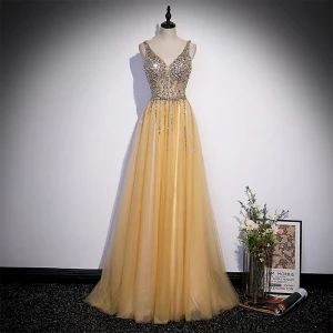 Chic Belle Jaune Perlage Paillettes Robe De Bal 2022 Princesse V Cou Sans Manches Dos Nu Longue Robe De Ceremonie