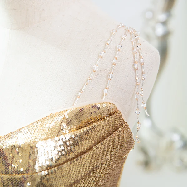 Scintillantes Doré Paillettes Robe De Soirée 2024 Trompette / Sirène Bustier Sans Manches Dos Nu Train De Balayage Soirée Robe De Ceremonie