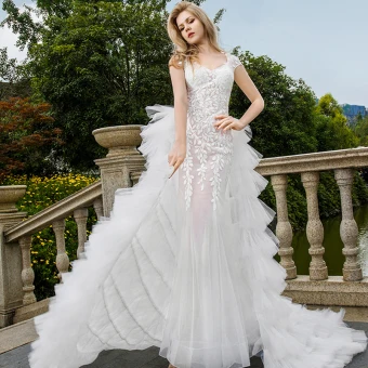 Sexy White Wedding Dresses 2018 Trumpet Mermaid Appliques Lace See Through V Neck Backless Cap Sleeves Sweep Train Wedding