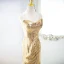 Scintillantes Doré Paillettes Robe De Soirée 2024 Trompette / Sirène Bustier Sans Manches Dos Nu Train De Balayage Soirée Robe De Ceremonie