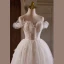 Charmant Blanche Perlage En Dentelle Fleur Appliques Courte Robe De Fête 2024 Robe Boule Bretelles Spaghetti Sans Manches Dos Nu Robe De Ceremonie