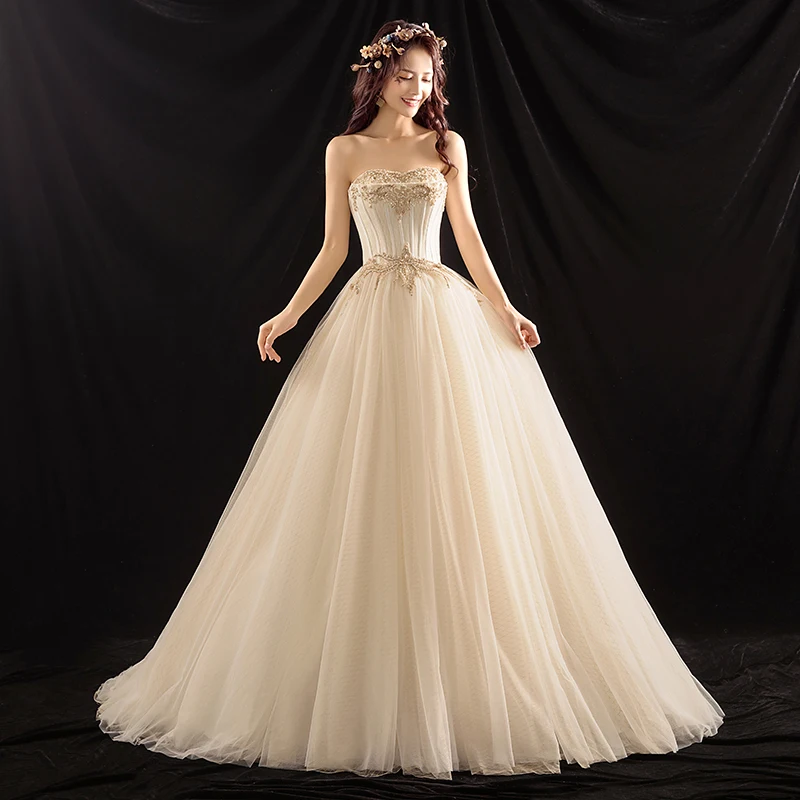 Elegant Champagne Brudekjoler 2018 Ballkjole Beading Perle Kjæreste Ryggløse Uten Ermer Feie Tog Bryllup