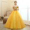 Chic / Beautiful Gold Prom Dresses 2020 Ball Gown Off-The-Shoulder Short Sleeve Appliques Lace Pearl Beading Floor-Length / Long Ruffle Backless Formal Dresses