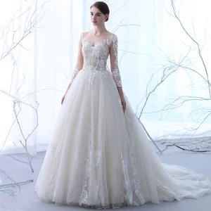 Élégant Champagne Transparentes Robe De Mariée 2018 Princesse Encolure Dégagée Manches Longues Appliques Percé En Dentelle Volants Chapel Train