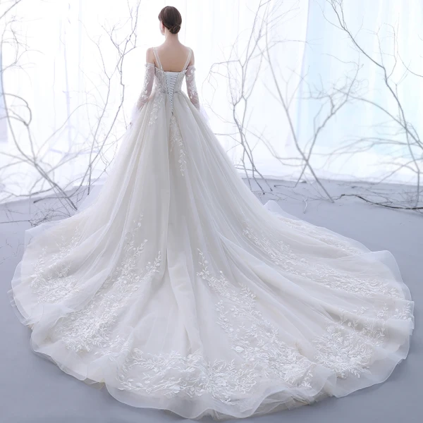 Chic / Belle Champagne Transparentes Robe De Mariée 2018 Robe Boule Bustier Manches Longues Dos Nu Appliques En Dentelle Volants Cathedral Train