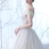 Elegant Champagne Wedding Dresses 2018 Ball Gown Off-The-Shoulder Short Sleeve Backless Appliques Lace Ruffle Chapel Train