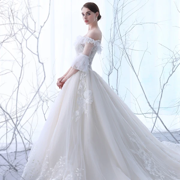 Schöne Champagner Durchsichtige Brautkleider 2018 Ballkleid Off Shoulder 3/4 Ärmel Rückenfreies Applikationen Mit Spitze Perlenstickerei Rüschen Kathedrale Schleppe