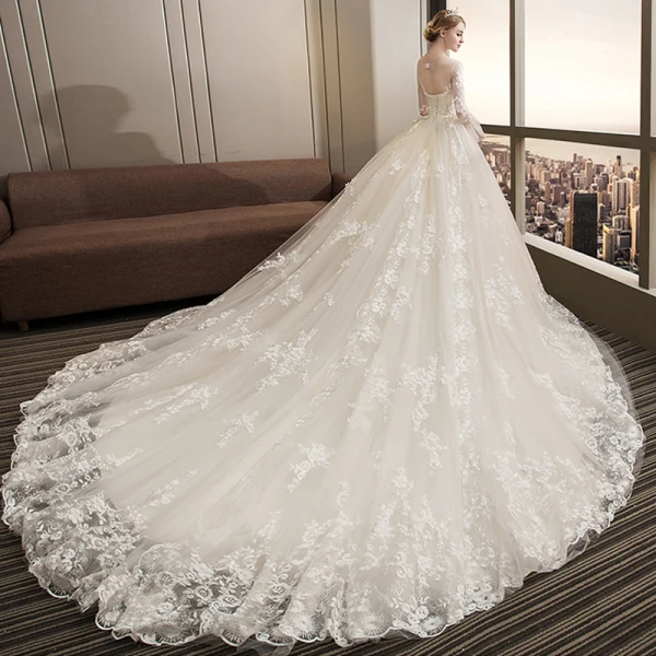 Stunning Champagne Wedding Dresses 2018 Ball Gown Lace Appliques Pearl Scoop Neck Backless Long Sleeve Royal Train Wedding