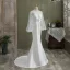 Mode Ivory / Creme Meerjungfrau Brautkleider / Hochzeitskleider 2021 Rundhalsausschnitt Pailletten Schleife Spitze Blumen Lange Ärmel Rückenfreies Sweep / Pinsel Zug Hochzeit