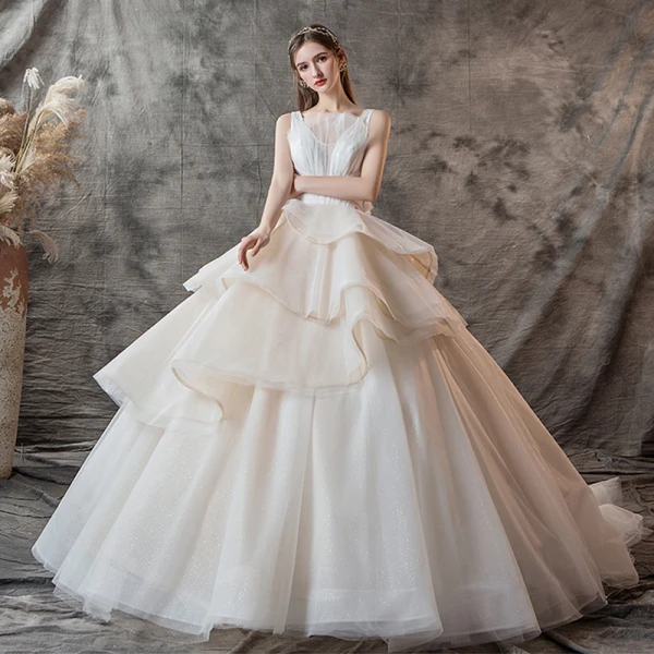 Charming Champagne Wedding Dresses 2019 Ball Gown V-Neck Pearl Sleeveless Backless Cascading Ruffles Cathedral Train
