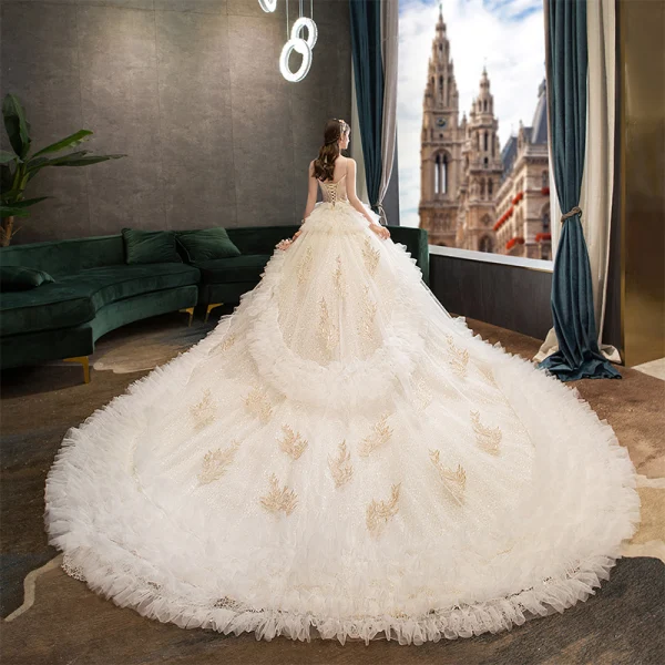 Fabulous Champagne Wedding Dresses 2019 Ball Gown Spaghetti Straps Ruffle Lace Flower Sequins Sleeveless Backless Royal Train