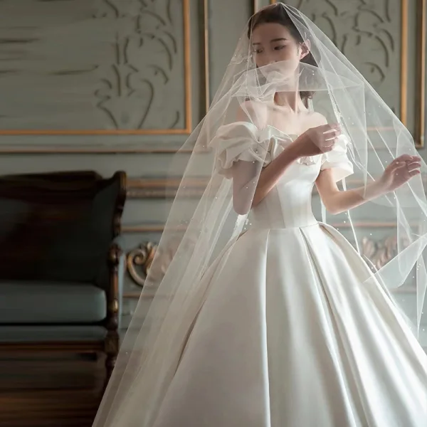 High-end Modest / Simple Ivory Satin Wedding Dresses 2021 Ball Gown Ruffle Off-The-Shoulder Short Sleeve Backless Royal Train Wedding