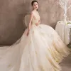 Luxury / Gorgeous Ivory See-through Wedding Dresses 2018 A-Line / Princess Scoop Neck Sleeveless Backless Gold Appliques Lace Ruffle Royal Train