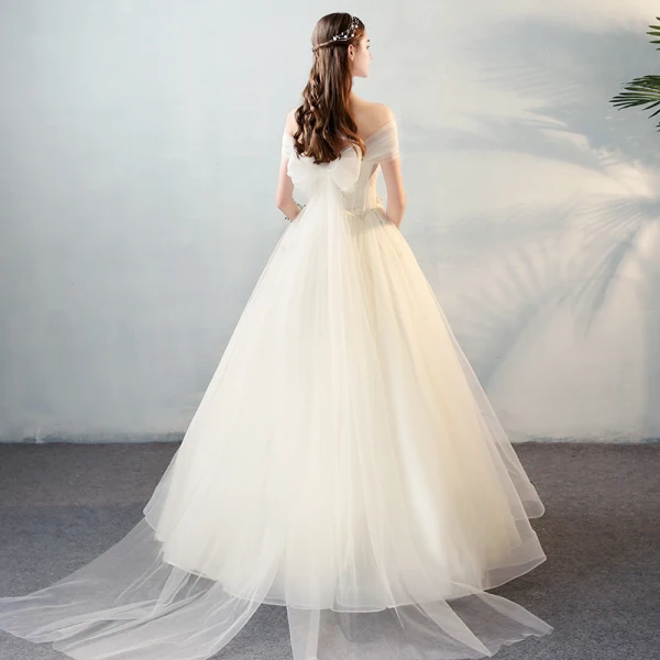 Schöne Ivory / Creme Brautkleider 2018 A Linie Mit Spitze Applikationen Perle Schleife Off Shoulder Rückenfreies Lange Hochzeit