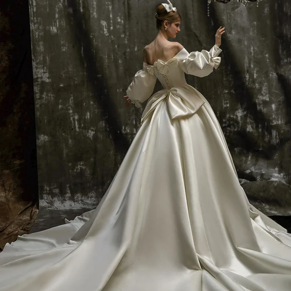 High-end Ivory Bow Satin Wedding Dresses 2022 Ball Gown Off-The-Shoulder Puffy Long Sleeve Backless Royal Train Wedding