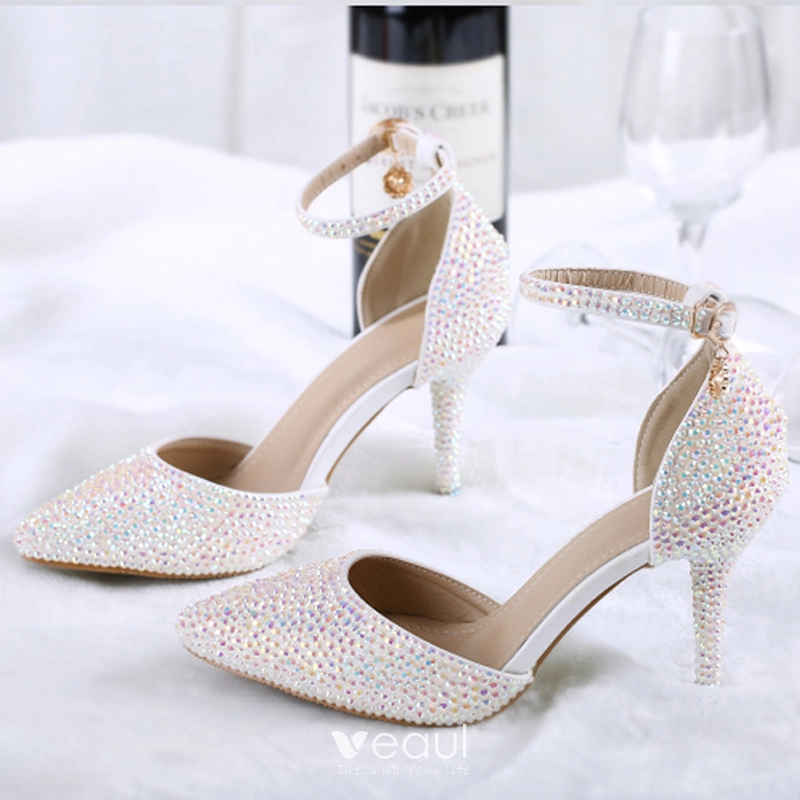 Sparkly blush wedding shoes with engagement ring on heel