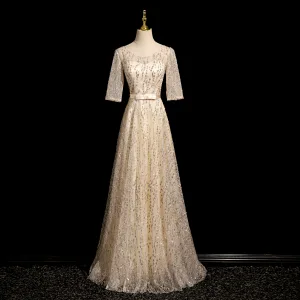 Bling Bling Champagne Paljetter Ballkjoler 2024 Prinsesse Scoop Halsen Korte Ermer Ryggløse Sløyfe Sash Lange Ball Formelle Kjoler
