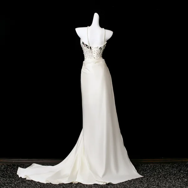Sexy Ivory / Creme Perlenstickerei Pailletten Perle Quaste Gespaltete Front Abendkleider 2025 Meerjungfrau Bandeau Ärmellos Rückenfreies Sweep / Pinsel Zug Festliche Kleider