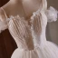 Charmant Blanche Perlage En Dentelle Fleur Appliques Courte Robe De Fête 2024 Robe Boule Bretelles Spaghetti Sans Manches Dos Nu Robe De Ceremonie
