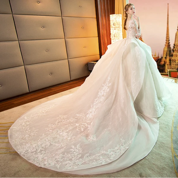 Audrey Hepburn Style Champagne Wedding Dresses 2019 Ball Gown See-through Scoop Neck Lace Appliques 3/4 Sleeve Backless Cascading Ruffles Royal Train