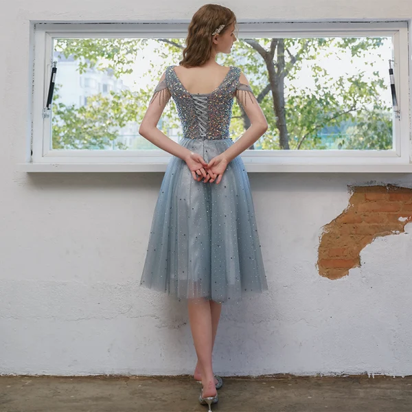 Scintillantes Bleu Ciel Robe De Graduation 2021 Princesse Encolure Dégagée Perlage Gland Paillettes Sans Manches Dos Nu Thé Longueur Soirée Robe De Ceremonie