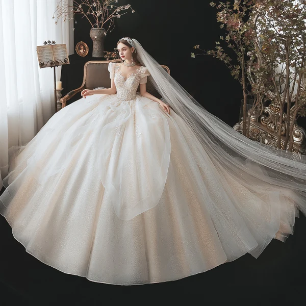 Fabelhaft Charmant Champagner Fallende Rüsche Brautkleider / Hochzeitskleider 2021 Ballkleid Stehkragen Perlenstickerei Pailletten Applikationen Kurze Ärmel Rückenfreies Königliche Schleppe Hochzeit