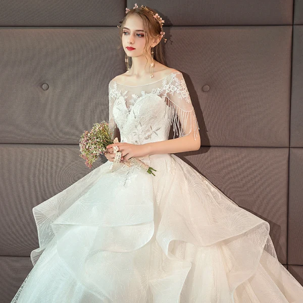 Charming Ivory Wedding Dresses 2019 Ball Gown Scoop Neck Lace Flower Beading Tassel Short Sleeve Backless Cascading Ruffles Cathedral Train Wedding