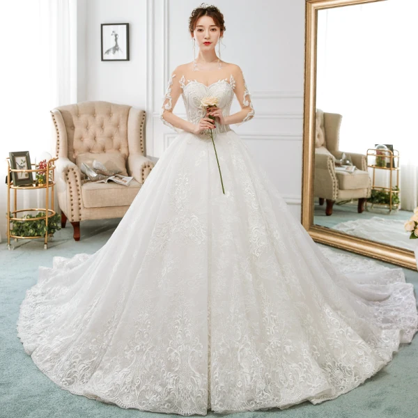 Charmant Ivoire Transparentes Robe De Mariée 2018 Princesse Encolure Dégagée 3/4 Manches Dos Nu Perlage Appliques En Dentelle Volants Royal Train
