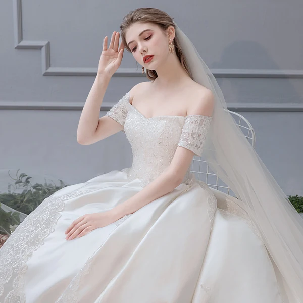 Luxury / Gorgeous Ivory Pierced Wedding Dresses 2019 A-Line / Princess Off-The-Shoulder Beading Sequins Lace Flower Short Sleeve Backless Royal Train