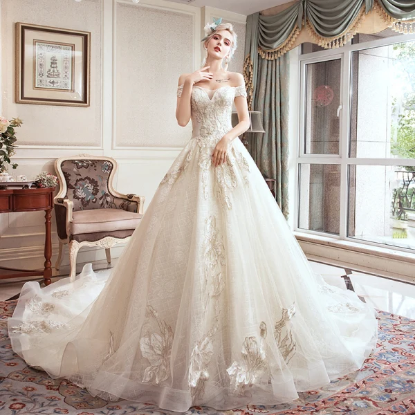 Schöne Champagner Brautkleider / Hochzeitskleider 2019 A Linie Off Shoulder Perlenstickerei Strass Spitze Blumen Kurze Ärmel Rückenfreies Königliche Schleppe