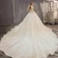 Fabuleux Champagne Robe De Mariée 2019 Princesse Bustier Perlage Paillettes Sans Manches Dos Nu Appliques Noeud Royal Train