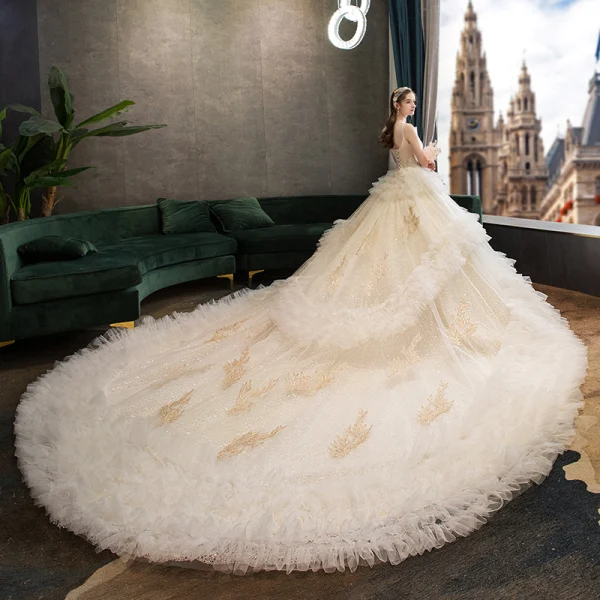 Fabulous Champagne Wedding Dresses 2019 Ball Gown Spaghetti Straps Ruffle Lace Flower Sequins Sleeveless Backless Royal Train