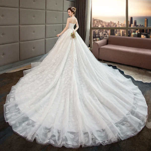 Edles Ivory / Creme Brautkleider / Hochzeitskleider 2019 A Linie Perlenstickerei Perle Pailletten Spitze Blumen Ärmellos Rückenfreies Königliche Schleppe