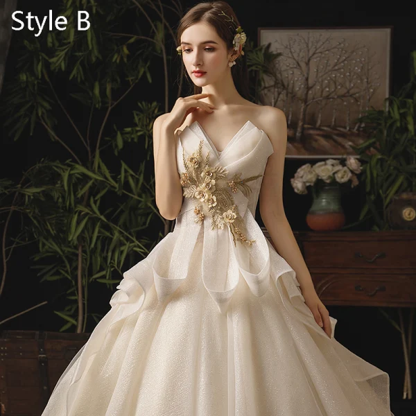 Edles Champagner Brautkleider / Hochzeitskleider 2019 A Linie Bandeau Applikationen Perle Pailletten Spitze Blumen Ärmellos Rückenfreies Fallende Rüsche Königliche Schleppe