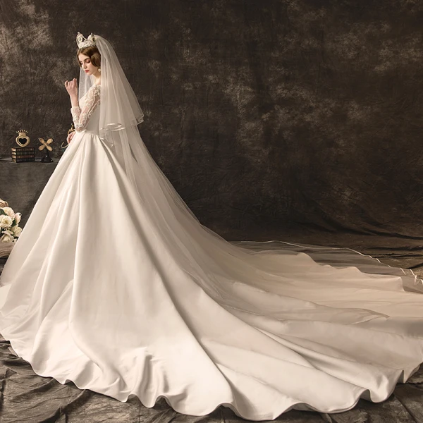 Élégant Ivoire Robe De Mariée 2019 Princesse Encolure Dégagée Noeud En Dentelle Fleur Manches Longues Dos Nu Cathedral Train