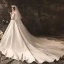 Élégant Ivoire Robe De Mariée 2019 Princesse Encolure Dégagée Noeud En Dentelle Fleur Manches Longues Dos Nu Cathedral Train